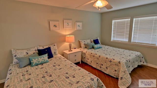 bedroom featuring ceiling fan and dark hardwood / wood-style floors