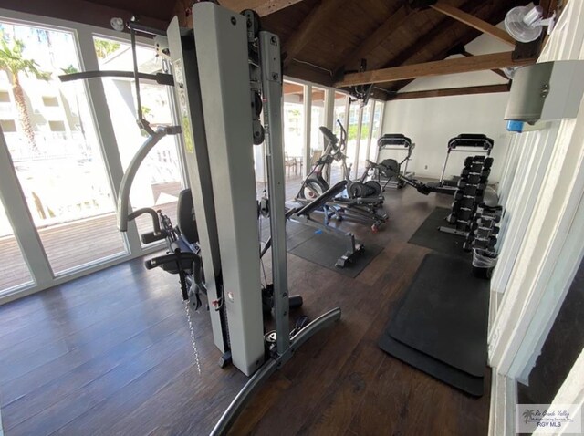 workout area with wooden ceiling, dark wood-type flooring, and vaulted ceiling