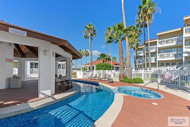 200 S Padre Blvd Unit 1303, South Padre Island, TX 78597 - view of swimming pool featuring a pool with connected hot tub