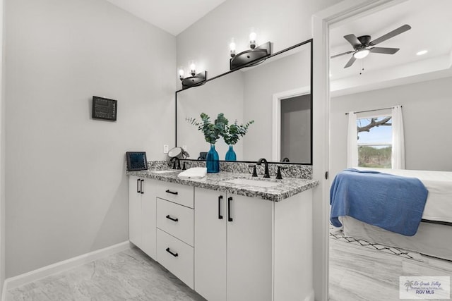 bathroom with ceiling fan and vanity