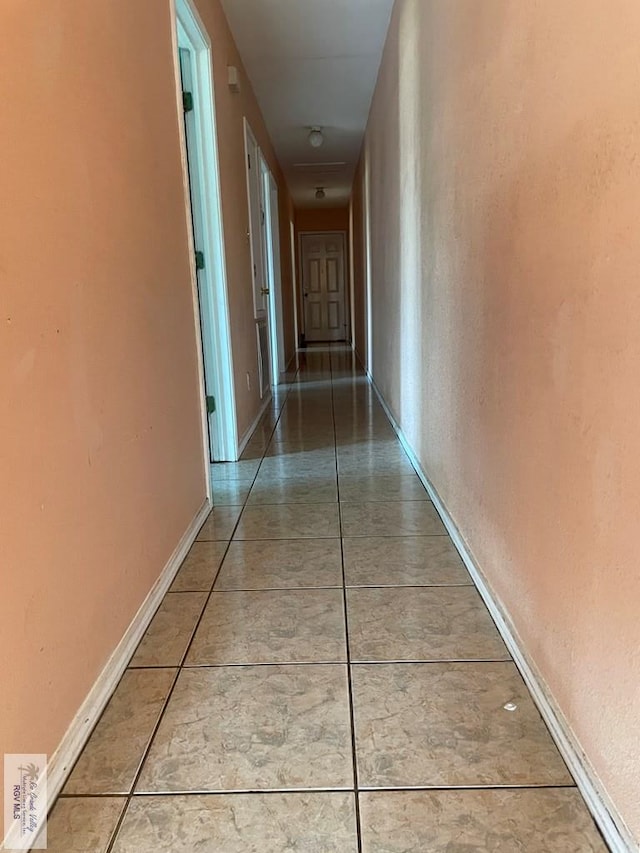 corridor featuring tile patterned floors