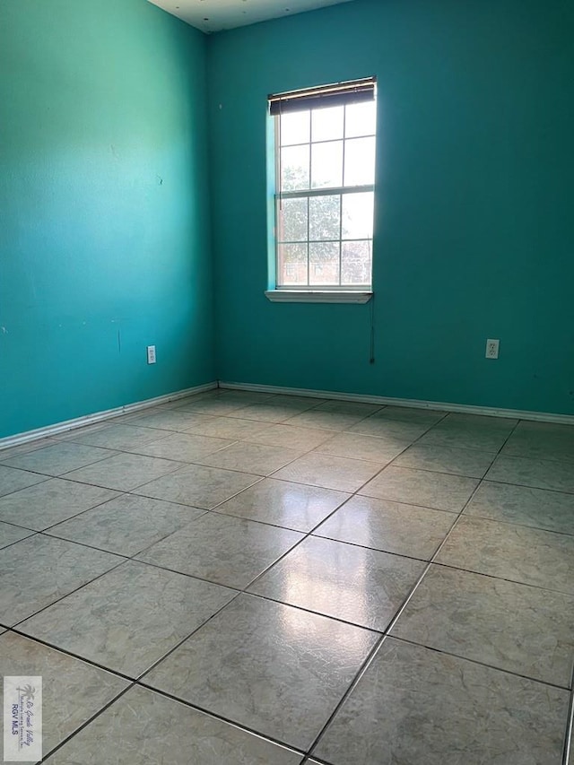 view of tiled spare room