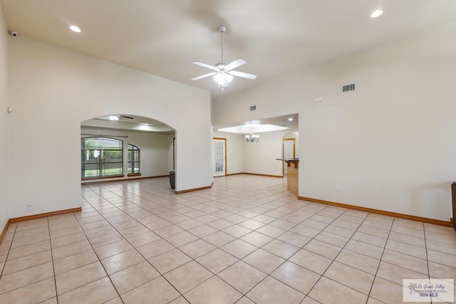 5662 Rustic Manor Dr, Brownsville, TX 78526 - empty room featuring arched walkways, ceiling fan, light tile patterned floors, recessed lighting, and baseboards
