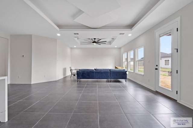 473 Santiago St, La Feria, TX 78559 - living room with recessed lighting, a raised ceiling, dark tile patterned flooring, and ceiling fan