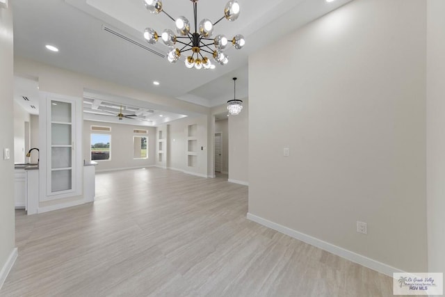 23547 Murphy Ct, Harlingen, TX 78552 - unfurnished living room with light wood-type flooring, baseboards, recessed lighting, a chandelier, and a ceiling fan