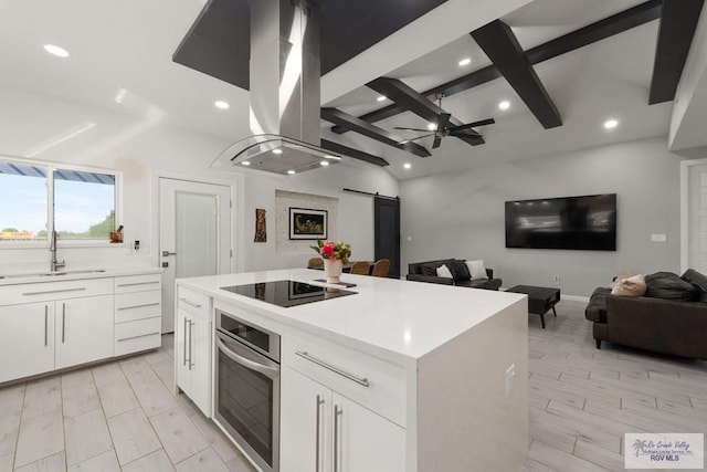 269 Cameo Dr, San Benito, TX 78586 - kitchen featuring stainless steel oven, a sink, black electric cooktop, a barn door, and recessed lighting