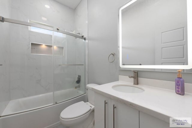 269 Cameo Dr, San Benito, TX 78586 - full bath with toilet, vanity, and enclosed tub / shower combo