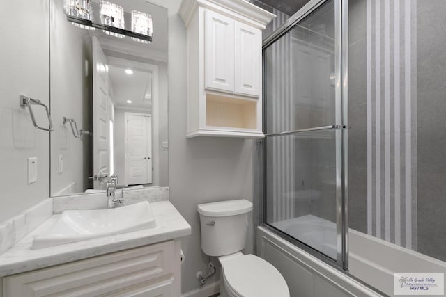 full bathroom with vanity, toilet, and enclosed tub / shower combo