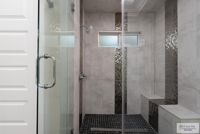 bathroom with a shower with shower door