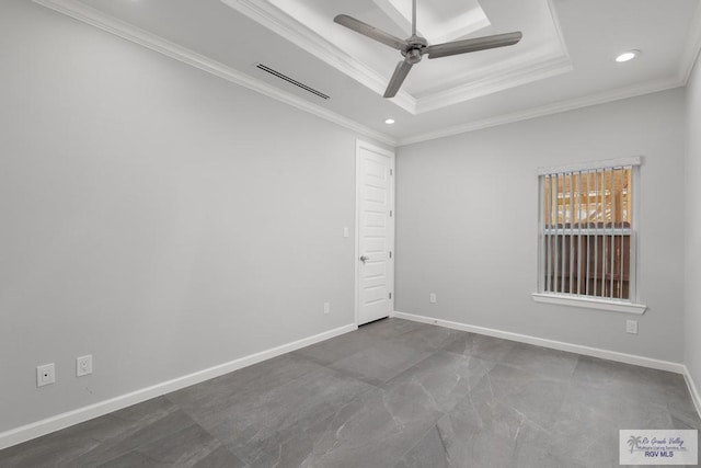 unfurnished room with ceiling fan, a raised ceiling, and ornamental molding