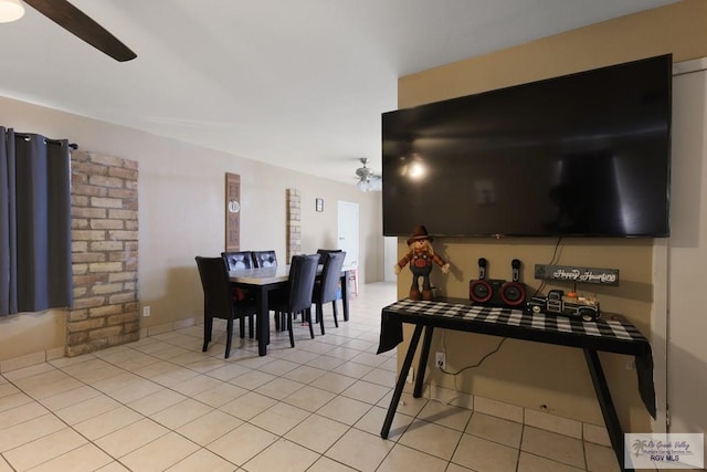 interior space featuring light tile patterned floors and a ceiling fan