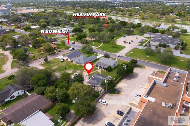 bird's eye view featuring a water view and a residential view