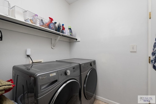 2853 Fleet St, Brownsville, TX 78521 - laundry area with separate washer and dryer and baseboards