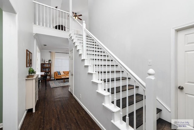 2853 Fleet St, Brownsville, TX 78521 - stairway with wood finished floors, a ceiling fan, and a towering ceiling