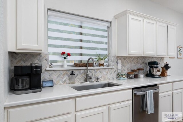 2853 Fleet St, Brownsville, TX 78521 - kitchen featuring dishwasher, decorative backsplash, white cabinets, and light countertops
