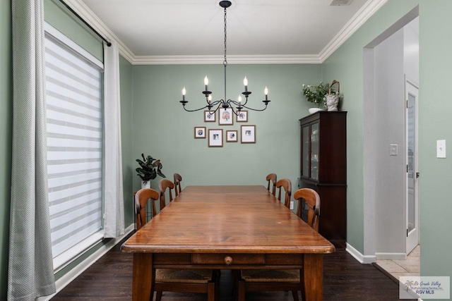 2853 Fleet St, Brownsville, TX 78521 - dining space featuring wood finished floors, a chandelier, ornamental molding, and plenty of natural light