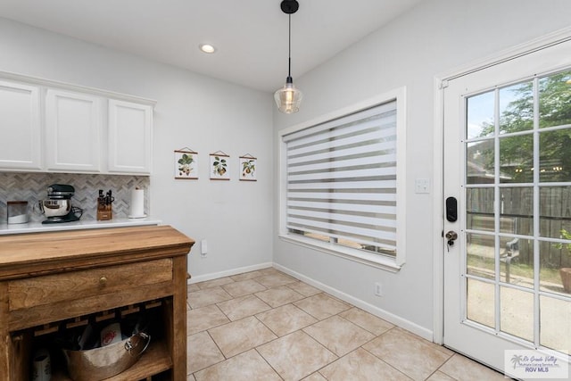 2853 Fleet St, Brownsville, TX 78521 - doorway to outside featuring light tile patterned floors and recessed lighting