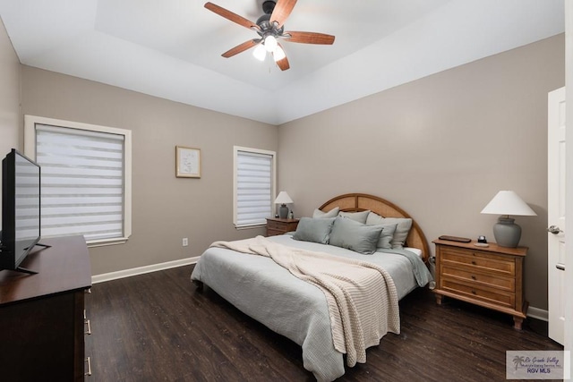 2853 Fleet St, Brownsville, TX 78521 - bedroom featuring wood finished floors, a ceiling fan, and a raised ceiling