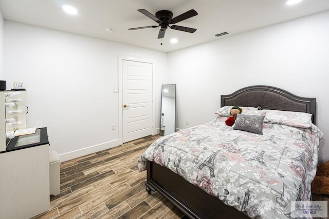 bedroom featuring dark wood-type flooring and ceiling fan