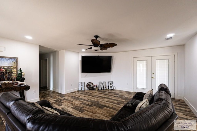 living room featuring dark wood-type flooring, french doors, and ceiling fan