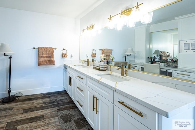 bathroom featuring hardwood / wood-style flooring and vanity