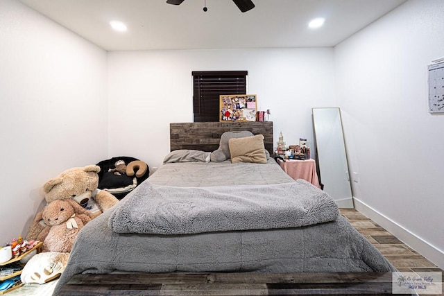 bedroom featuring ceiling fan and wood-type flooring