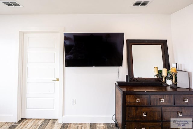 bedroom with light hardwood / wood-style floors