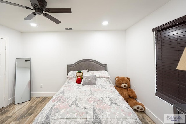 bedroom featuring wood-type flooring and ceiling fan