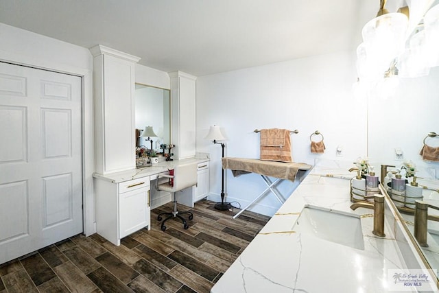 office with dark hardwood / wood-style floors and sink