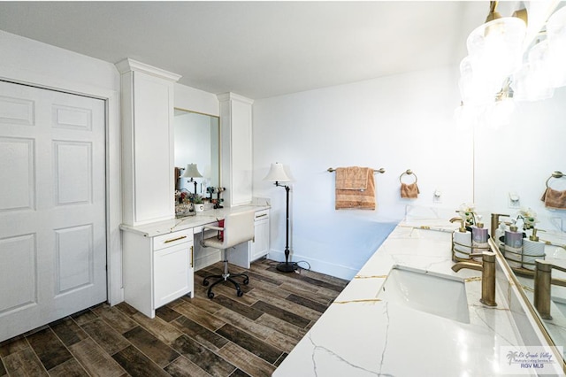 home office featuring dark wood-type flooring and sink