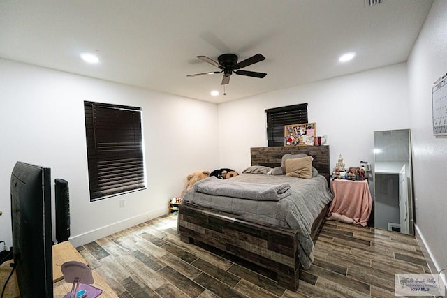 bedroom featuring dark hardwood / wood-style floors and ceiling fan