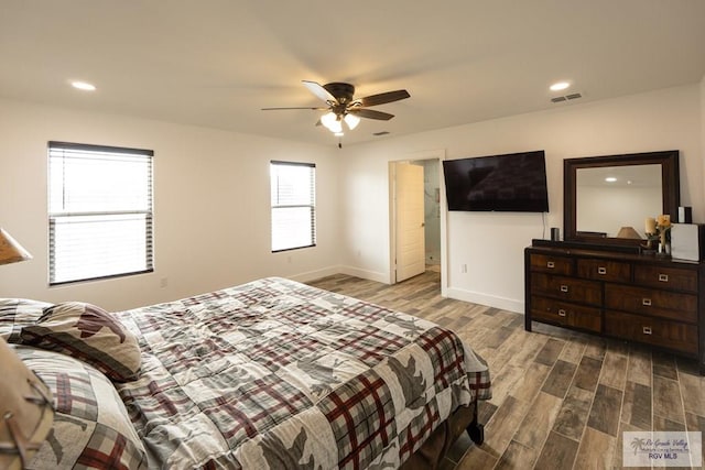 bedroom with ceiling fan and light hardwood / wood-style floors