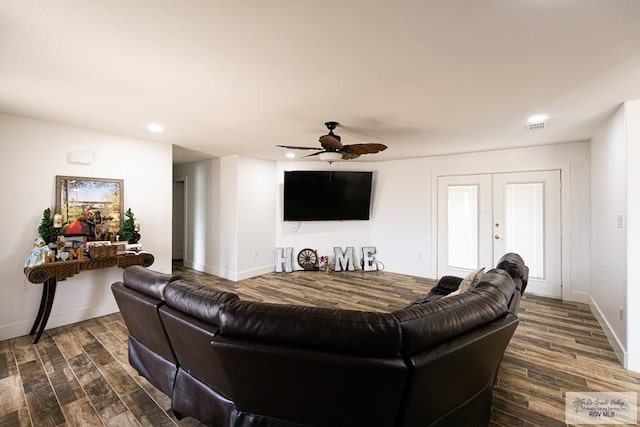 living room with french doors, ceiling fan, and dark hardwood / wood-style floors