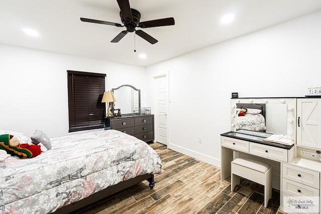 bedroom featuring dark hardwood / wood-style flooring and ceiling fan