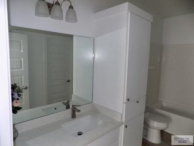 bathroom with vanity and toilet