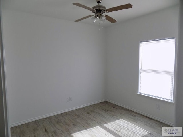 empty room featuring ceiling fan and light hardwood / wood-style floors