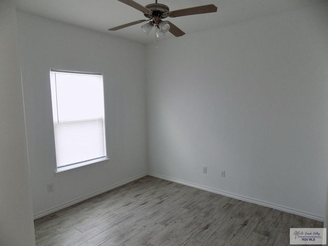 unfurnished room with light hardwood / wood-style floors, ceiling fan, and a healthy amount of sunlight