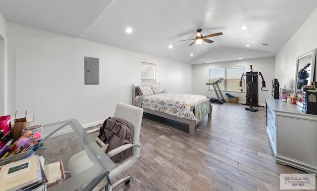 bedroom with lofted ceiling, hardwood / wood-style flooring, electric panel, and ceiling fan