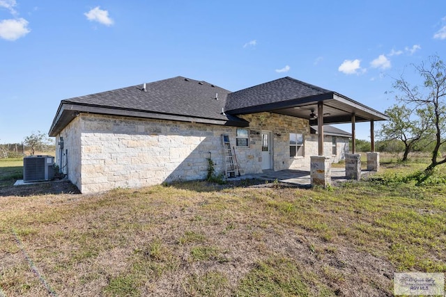 back of property featuring a patio, central AC, ceiling fan, and a lawn