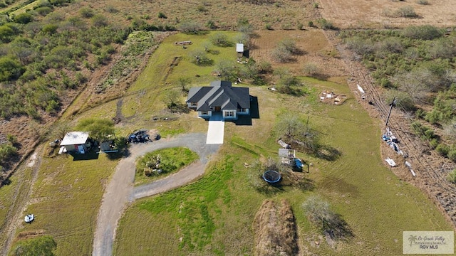 birds eye view of property featuring a rural view