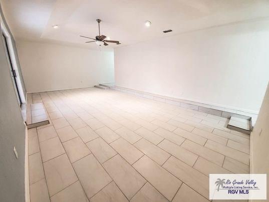 spare room featuring ceiling fan