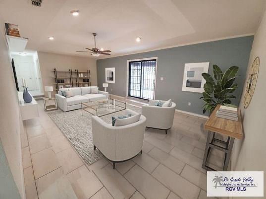 living room with a ceiling fan, recessed lighting, visible vents, and baseboards