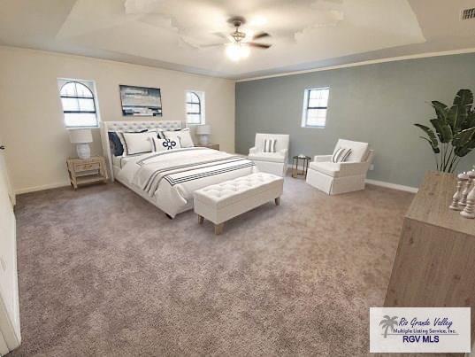 bedroom with carpet floors, multiple windows, visible vents, and baseboards