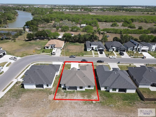 7336 San Andres St, Brownsville, TX 78526 - aerial perspective of suburban area featuring a nearby body of water and property parcel outlined