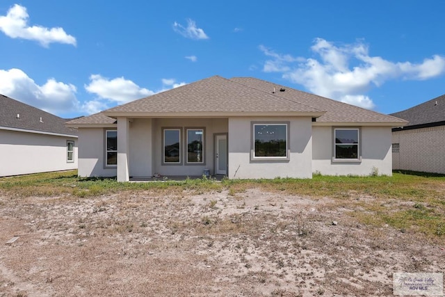 7336 San Andres St, Brownsville, TX 78526 - rear view of house with stucco siding and a shingled roof