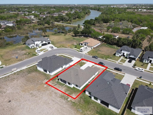 7336 San Andres St, Brownsville, TX 78526 - aerial perspective of suburban area featuring a nearby body of water and property boundaries highlighted
