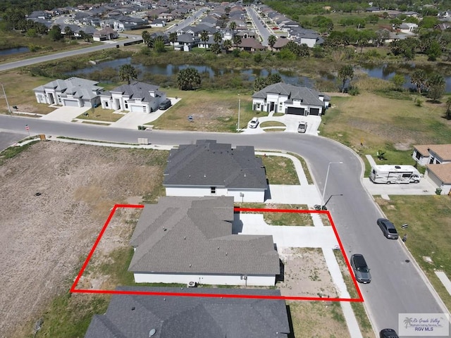 7336 San Andres St, Brownsville, TX 78526 - aerial view of residential area with a nearby body of water and property boundaries highlighted