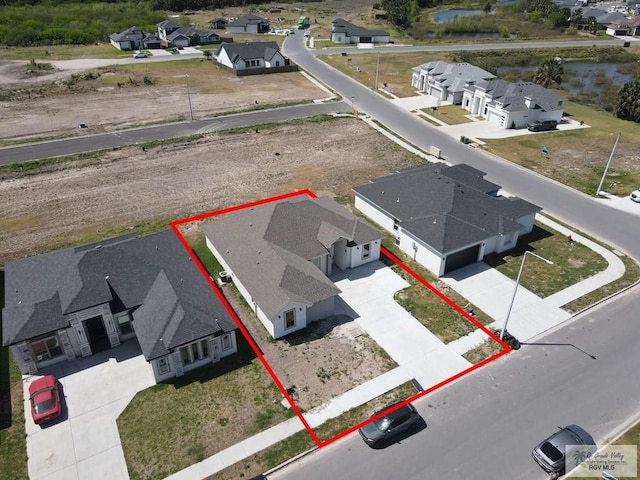 7336 San Andres St, Brownsville, TX 78526 - aerial view of residential area featuring property boundaries highlighted and a nearby body of water