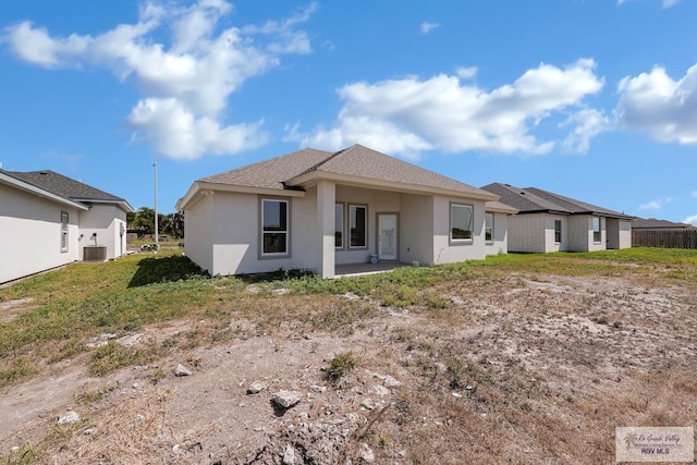7336 San Andres St, Brownsville, TX 78526 - rear view of house with central AC and stucco siding
