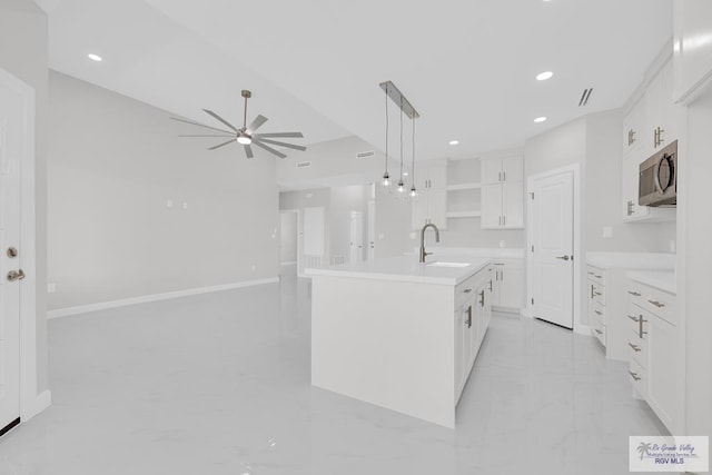 7336 San Andres St, Brownsville, TX 78526 - kitchen featuring a sink, a ceiling fan, light marble finish floors, open shelves, and white cabinets